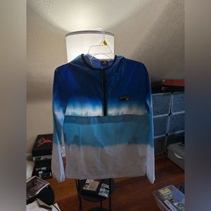 Women’s New Balance size small, blue and white wind breaker